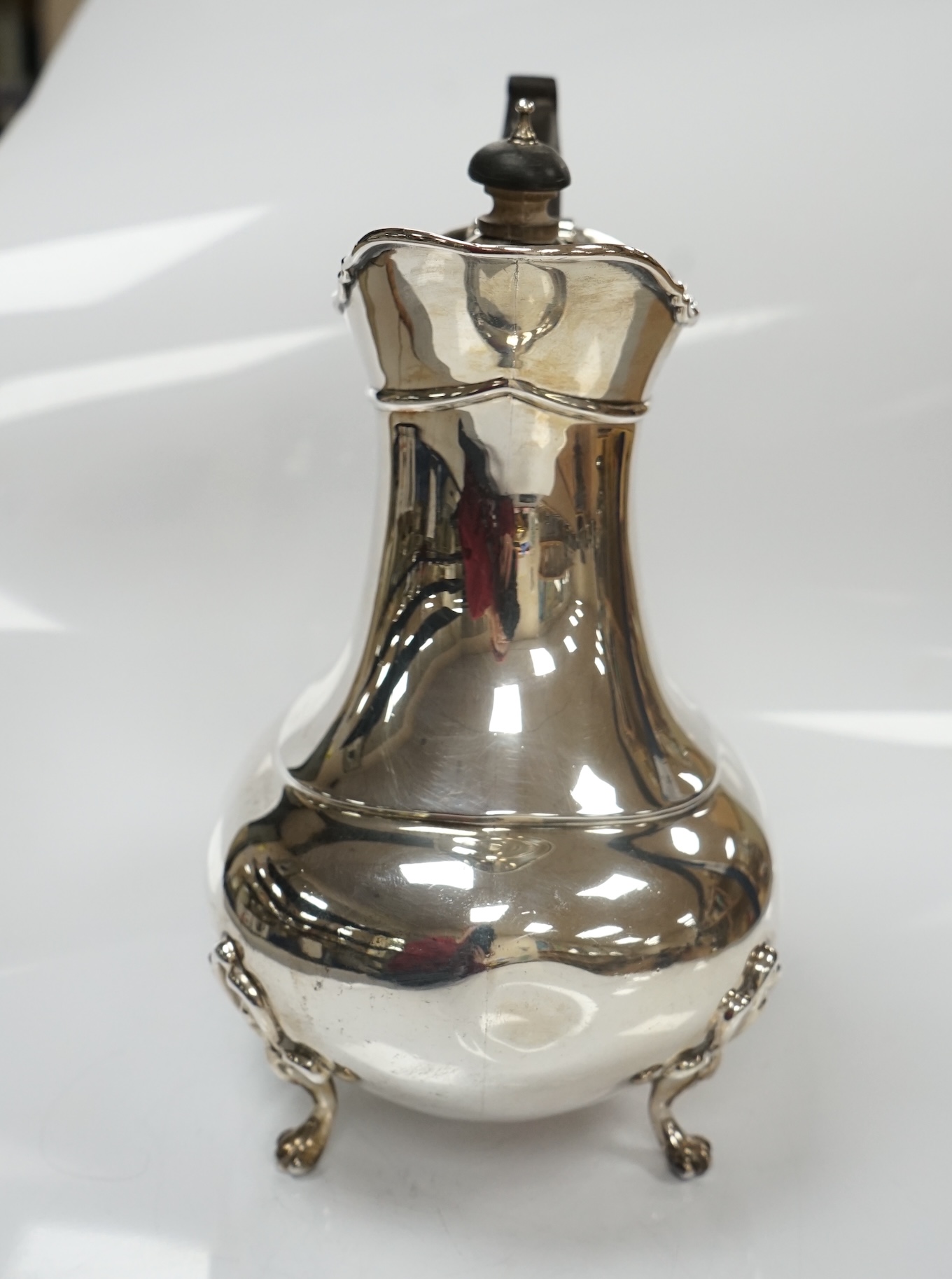 An Edwardian Scottish silver hot water pot, by Hamilton & Inches, Edinburgh, 1902, height 20.8cm, 20.9oz. Condition - fair to good